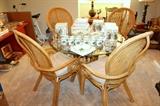 Glass-top rattan table with 4 chairs