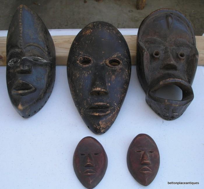 African Masks from Liberia region  Dan...the smaller faces are "like" passports in the region when entering different tribes....