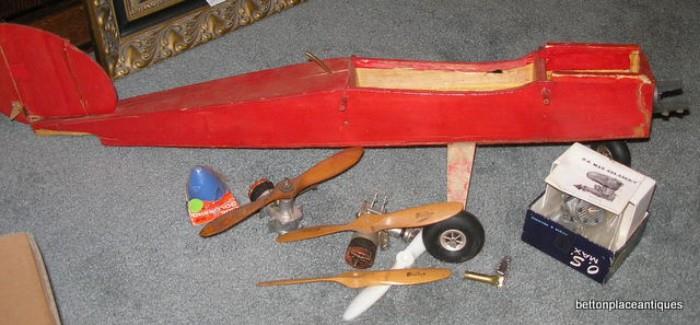 Model Plane with parts for it, including motors