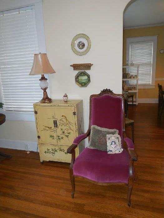 Painted Cabinet beside Carved Arm Chair
