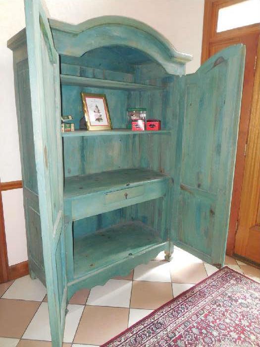 Inside of large painted cabinet