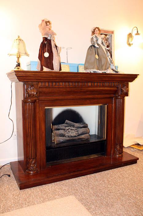 Solid wood fireplace mantle.  Firebox insert is vintage and decoration only.  No heat is produced, just ambiance.  Plug in and watch "flames" flicker.  Fun!