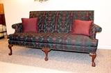 High back loveseat originally purchased from Robbins Furniture of Owosso. Very high quality piece. Hunter green and mauve, solid wood frame