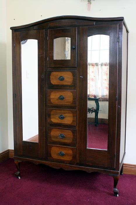 Antique Armoire. Both side compartments are for hanging clothing.63.5 H x 43w x 22.75D