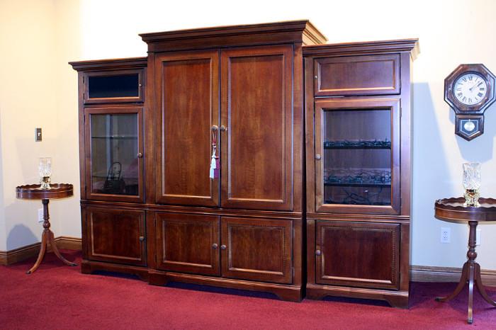 Hammary Home Entertainment Center, Made in the U.S.A. (Lenoir,N.C.)  Three units, solid wood.  Originally purchased from Pilgrim House.  Front panels in upper doors can be switched to your choice of either surround sound speaker grills or solid wood.  Center cabinet will hold up to a 40" flat screen.  72H x 49W x 26D  side units are 66H x 28W x 22D