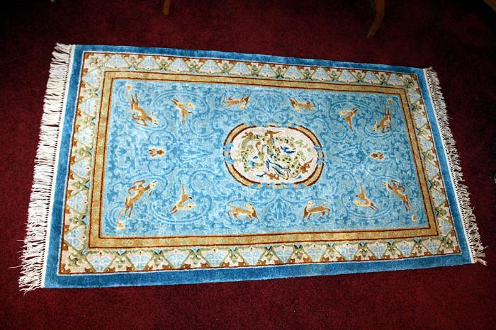 Stunning silk rug, hand woven from China.  Teal, baby blue, beige, cream and brown silk fibers. 3x5 