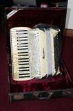 Accordiana model 46 accordion. 120 bass buttons; and 2 rocker type voice switches