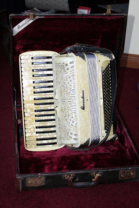 Accordiana model 46 accordion.  120 bass buttons; and 2 rocker type voice switches 