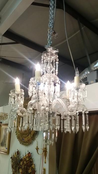 Lord have mercy! Look at that Waterford looking chandelier. How'd THAT thing get in here?