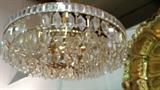 Not a great pic, but this is an English MCM crystal chandelier, that looks as if it's gold plated. Squint.