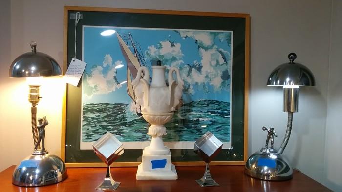 Close-up of the two 1950's chrome table lamps. Pair of newer chrome photo cubes, 1950's carved marble lamp base, original, artist signed seascape. 