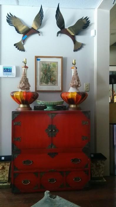 Very nice Asian Chest, with pair of wonderfully color-coordinated lamps, pair of tole planters, original framed artwork, circled by two hungry seagulls. Their parents starred in the 1963 Hitchcock thriller, "The Birds".