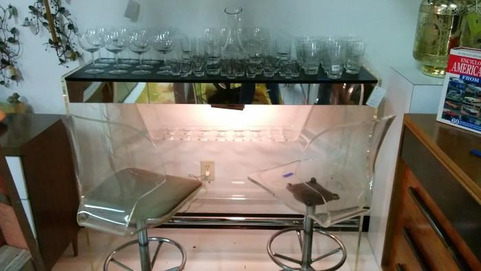 Acrylic bar, with pair of acrylic barstools and assorted time capsule barware.