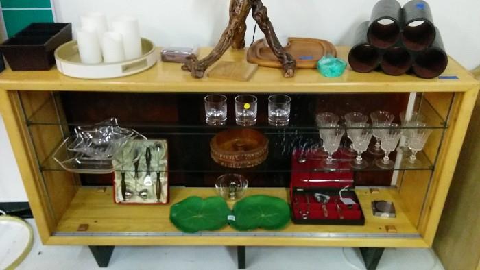 MCM Tiki Hut bar, with sliding acrylic panels, two glass shelves, assorted barware, Adam's XXL Fig Leaf snack tray, vintage wooden nut cracking system, serving tray with electric candles.