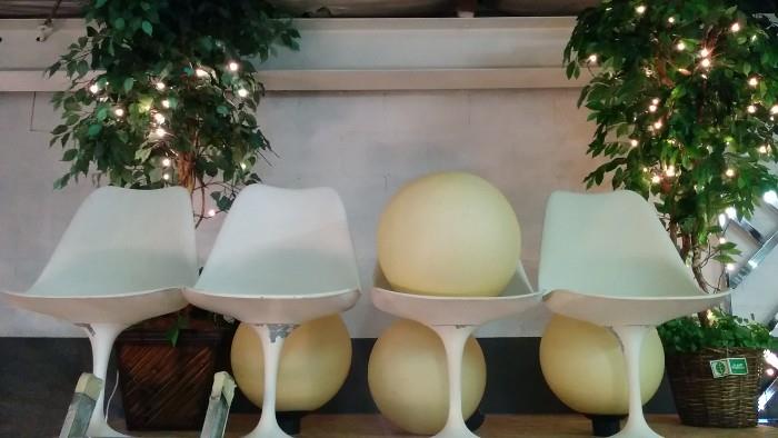 4 plastic spheres of love, 4 Saarinen chairs, ret to go for restoration (too many projects) flanked by a pair of aura-recharging silk ficus trees, with twinkling white lights.