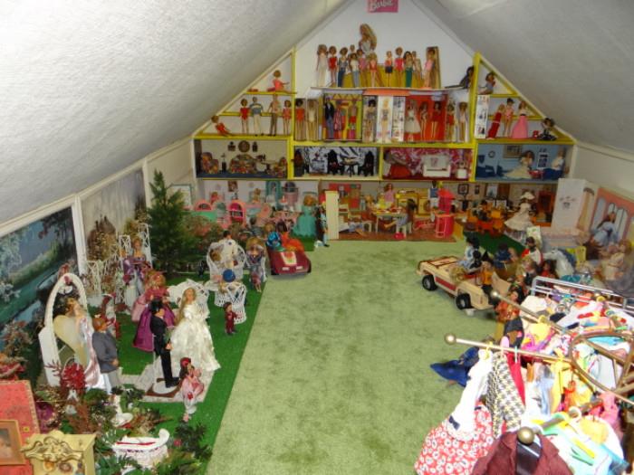 THE OTHER END OF THE ROOM WITH BARBIES ETC. THERE IS ALSO ANOTHER AREA FILLED WITH THEM.