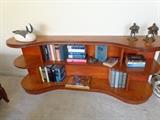 Funky, mid-century kidney shaped all-wood low bookcase. 