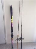 Fischer skis and fishing poles.