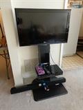 LG 32" flatscreen TV on adjustable stand.