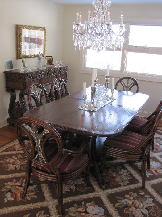 Dining table with 3 leaves and 8 Prince Of Wales Feather back design chairs.