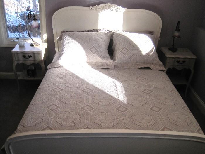 Queen size bed with nightstands.