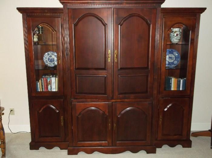 Center entertainment cabinet w/two separate lighted bookcases/curios on each side 