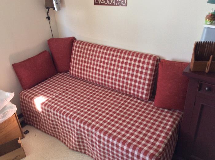 very nice trundle day bed with custom red check cover
