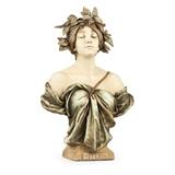 1028  An Ernst Wahliss / Amphora ceramic bust, ''Daphne''
After 1900, Turn-Teplitz, Bohemia, impressed ''4263'', titled ''Daphne.'' to base, depicting a draped beauty wearing a foliate crown over an integral square base, 28.75'' H x 18.5'' W x 7.5'' D, est: $4000/6000

Literature: This model illustrated, B. Vreeland, ''Monsters & Maidens: Collector's Edition'', Fledermaus Press, 2011, p. 432.  Provenance: Private Collection, Southern California.  Condition: Overall good condition. General light marks, scratches and rubbing commensurate with age. Scattered professional restorations to leaf tips. An approximately 2''-long tight hairline crack to base.  Your bid indicates acceptance of our Conditions of Sale.  AS-IS.  ALL SALES FINAL