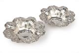 1061  A pair of Reed & Barton ''Francis I'' sterling silver bowls
One dated 1946, the other 1948, Taunton, MA, each with maker's marks, further marked ''Sterling / X569 / Francis I'', each with a circular flared scalloped rim repousse-decorated with C-scrolls, foliate clasps and fruiting pendants, over a tapering body, 2 pieces, each: 2.75'' H x 7.875'' Dia., total weight 19.985 oz troy approximately, est: $500/700

Provenance: Private Collection, La Jolla, CA.  Condition: Overall good condition. General marks, scratches, rubbed wear and tarnishing commensurate with age. With polish residue to crevices and sticker residue to undersides. One with a 1'' x .125'' section of shallow impressions to rim.  Your bid indicates acceptance of our Conditions of Sale.  AS-IS.  ALL SALES FINAL