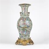 1094  A gilt bronze-mounted celadon ground Chinese export vase
20th century or earlier, the gilt bronze mount stamped ''T'' to underside, the vase with now deficient and illegible gilt-inscribed signature, the flared mouth polychrome-decorated to the interior with bunches of pink roses, over a stepped neck flanked by two shaped gilt-painted handles, over a baluster-form celadon-ground body overall gilt and polychrome-decorated with figural scenes, parcels and flowers, mounted on a gilt bronze floral and foliate-cast base, 26.5'' H x 11.75'' W x 12.5'' D, est: $1000/1500

Provenance: Private Collection, Pasadena, CA.  Condition: Overall good condition. General marks, scratches and rubbed wear to gilt decoration commensurate with age. Scratches and scattered losses to painted decoration; the largest area 1'' x 2'' approximately. Previous break and subsequent repair to mouth, with a corresponding 4'' x 3'' area of discoloration to white-ground interior. Mount with rubbing, darkening and s