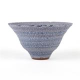 1098  An Otto and Gertrude Natzler lavender crater glaze bowl
Mid-20th century, signed in black ''Natzler'' for Gertrud Natzler (1908 - 1971, Los Angeles, CA) and Otto Natzler (1908 - 2007, Los Angeles, CA), the flaring rim over a circular body raised on a short circular foot, 3'' H x 5.5'' Dia., est: $1000/1500

Provenance: Private Collection, Altadena, CA.  Condition: Overall good condition. A .125''-long chip and scattered fleabites to foot.  Your bid indicates acceptance of our Conditions of Sale.  AS-IS.  ALL SALES FINAL