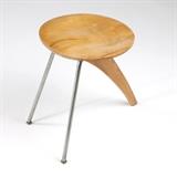 1115  An Isamu Noguchi ''Rudder'' stool, model IN-22
Designed 1944, unsigned, Isamu Noguchi (1904 - 1988 American), the circular birch wooden seat over a parabolic beech leg and two straight zinc-plated steel legs mounted with steel brackets to a plywood block mounted to underside of seat, 17.75'' H x 14'' W x 19.25'' D, est: $8000/12,000

Literature: Alexander von Vegesack et al, eds., Isamu Noguchi: Sculptural Design, exh. Cat., Vitra Design Museum, Weil am Rhein, 2002, pp. 120 - 124, models in different finishes illustrated p. 121.  Provenance: This lot, as well as the other Noguchi pieces on offer, was purchased by the Consignor circa 1949 directly from the Herman Miller Showroom at Chicago's Merchandise Mart in order to suit the decor of the Consignor's newly acquired modern apartment in Chicago's iconic Brockton building. The set has remained in the same Private Collection, Chicago, Illinois, ever since.  Condition: Structurally sound. General marks, scratches, nicks, and rubbed 