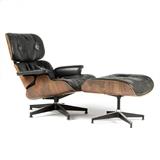 1119  An Eames/Herman Miller lounge chair 670 and ottoman 671
Second half 20th century, lacking labels, of five-ply molded walnut-veneered shells with black leather upholstery, each raised on polished and black-enameled aluminum bases, the chair with five legs and the ottoman with four, 2 pcs, the chair: 32.5'' H x 33'' W x 32'' D; the ottoman: 17.25'' H x 25.75'' W x 22.5'' D, est: $1500/2000

Provenance: Private Collection, Southern California.  Condition: General rubbed wear, marks and scattered scratches to wood shells. Chair with concentrated area of scratching and minor discoloration to veneer behind left armrest and spots of minor discoloration to finish at underside due to apparent liquid drips. Chair appears to have replaced seat foam. Each with scattered scuffs and minor chips to veneer around edges of shells, especially to ottoman. Each with extensive wear to leather; the chair with a 2.5''-long rip to top cushion near seam, the ottoman with scattered rips (the largest a 4''