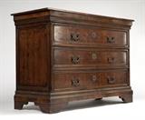 1193  A Baroque style walnut chest of drawers
Second half 20th century, the rectangular top over three drawers faced with foliate marquetry and cross banded borders, raised on bracket feet, 42'' H x 59'' W x 24.5'' D, est: $1000/2000

Provenance: Property of an Estate, Montecito, CA.  Condition: Overall good condition. Structurally sound. The timber intentionally distressed to give the appearance of age, with extensive marks, gouges, scratches and faux woodworm holes throughout. No key.  Your bid indicates acceptance of our Conditions of Sale.  AS-IS.  ALL SALES FINAL
