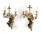 1220  A pair of French gilt bronze four light wall sconces
Late 19th century, unsigned, each with a gilt bronze foliate backplate issuing scrolled supports surmounted by an ebonized seated putti; one playing the cymbals, the other with a drum, rising to a bifurcated standard issuing four arms terminating in foliate-cast lights with faux candles, electrified, 2 pieces, the first: 30'' H x 18'' W x 15'' D; the second: 30 '' H x 16'' W x 16'' D, est: $2000/3000

Provenance: Property of a Private Collection, Malibu, CA.  Condition: General marks, scratches, rubbed wear, darkening to bronze and minor cracks commensurate with age. The first with repairs and new screws to backplate; glue evident. The second with central and right arm positions reversed.  Your bid indicates acceptance of our Conditions of Sale.  AS-IS.  ALL SALES FINAL
