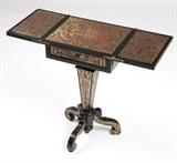 1232  A ''Boulle'' marquetry & ebonized wood side table
Late 19th / early 20th century, the hinged rectangular top over a drawer raised on a tapering pedestal base with three S-scrolled legs, veneered in a pattern of arabesques, 30.75'' H x 18.25'' W x 15'' D, est: $500/800

Provenance: Property of an Estate, Montecito, CA.  Condition: General marks, nicks and wear commensurate with age and use. Several areas of lifting to veneer throughout. Several large losses to veneer on legs. Rubbed wear and marks to top. With top unfolded: 36.25'' W.  Your bid indicates acceptance of our Conditions of Sale.  AS-IS.  ALL SALES FINAL