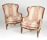 1235  A pair of French gilt bronze-mounted bergeres
First quarter 20th century, each with an arched-back gilt bronze-mounted frame, upholstered with later floral on striped-ground damask fabric, raised on four square tapered legs with columnar sabots, 39.25'' H x 29.5'' W x 29.5'' D, est: $1000/2000

Provenance: Property of a Private Collection, Malibu, CA.  Condition: Overall good condition. General minor marks, scratches and rubbed wear commensurate with age and use, with more extensive rubbed wear to mounts on hand rests. Refinished; finish with minor shrinkage-induced cracks to joints and scattered areas of minor chipping beneath mounts. Each with a minor break and subsequent repair to right side apron at leg joint. One with a broken vertical mount to front of left leg. Reupholstered, as stated.  Your bid indicates acceptance of our Conditions of Sale.  AS-IS.  ALL SALES FINAL