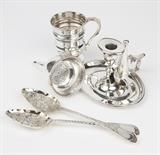 1252  A group of 5 Georgian sterling silver articles
Comprising: 1 Christening cup, 1776, London, with rubbed maker's mark, monogrammed ''GARL'' and inscribed ''Agnes'' (4'' H x 4'' W x 2.75'' D); 2 matching berry spoons, London, one dated 1787 with maker's mark for George Smith III & William Fearn, the other dated 1791 with maker's mark for Thomas Wallis, each repousse-decorated with birds and flowers and vermeiled to waved bowl rims and stems, each: 9''; 1 wine funnel with removable sieve, 1807, London, with partially rubbed maker's mark for John Emes (5.25'' H x 3.125'' Dia.); and 1 chamberstick with snuffer, 1803, London, with maker's mark for John Wren (4'' H x 6'' W x 5.625'' D), 5 pieces, 21.325 oz troy approximately, est: $800/1200

Condition: The Christening cup monogrammed and inscribed, as stated. Each in overall good condition, with general marks, scratches, tarnishing and wear commensurate with age. The wine funnel with a minor ding to bowl. The berry spoons with wear to v