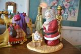 Praying Santa with baby Jesus