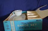 Adorable vintage milkglass service for four in the original box. Perfect for your next card party.