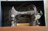 One of three of the sewing machines at the sale. This vintage model is by National Sewing and comes with a case.