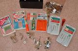 Singer Featherweight 221 attachments and needles included with the sewing machine