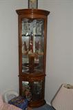 Lighted corner curio with curved front