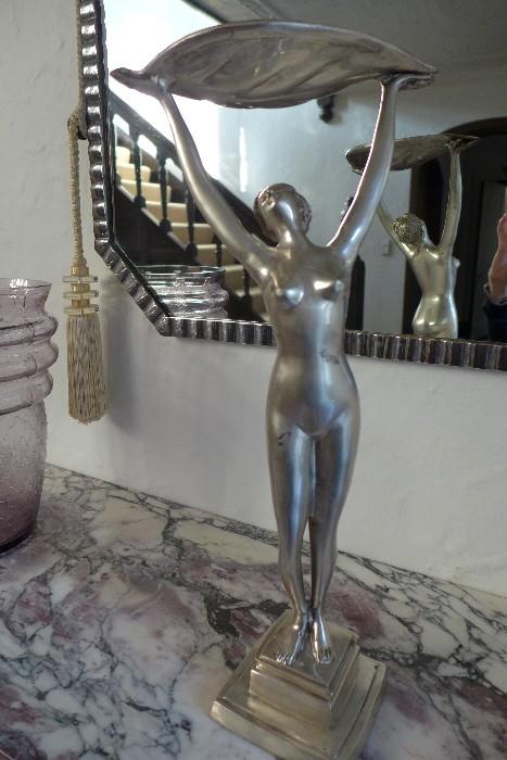 Art Deco cast metal sculpture depicting a female nude