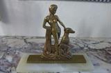 Art Deco patinated bronze sculpture mounted on white marble plinth