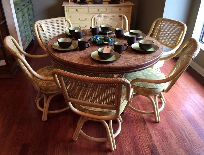 1970's rattan table with six swivel chairs and Dansk pottery set.