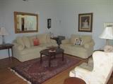 Sofa and loveseat, rugs, art, tables