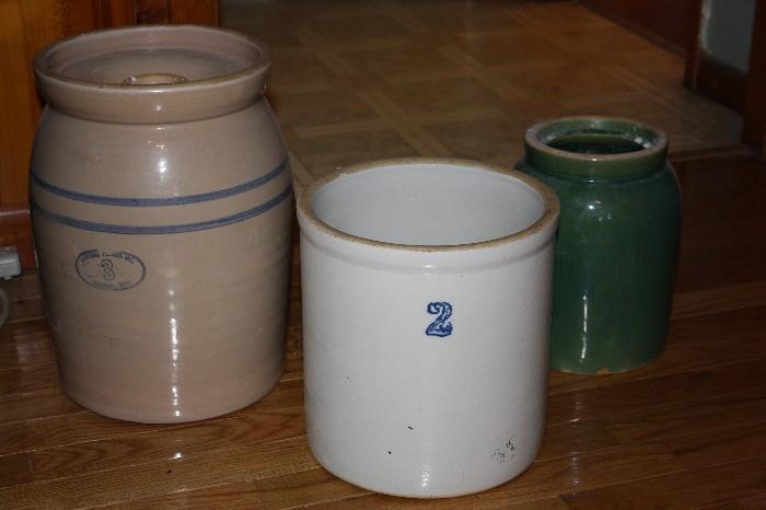 There are about 8 crocks and churns