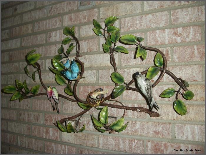 Large metal wall sculpture with birds.