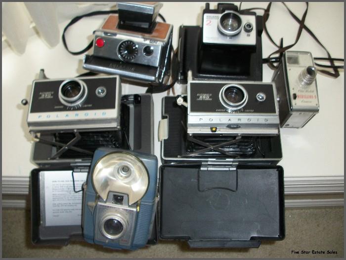 Many cameras from Polaroids to movie. 